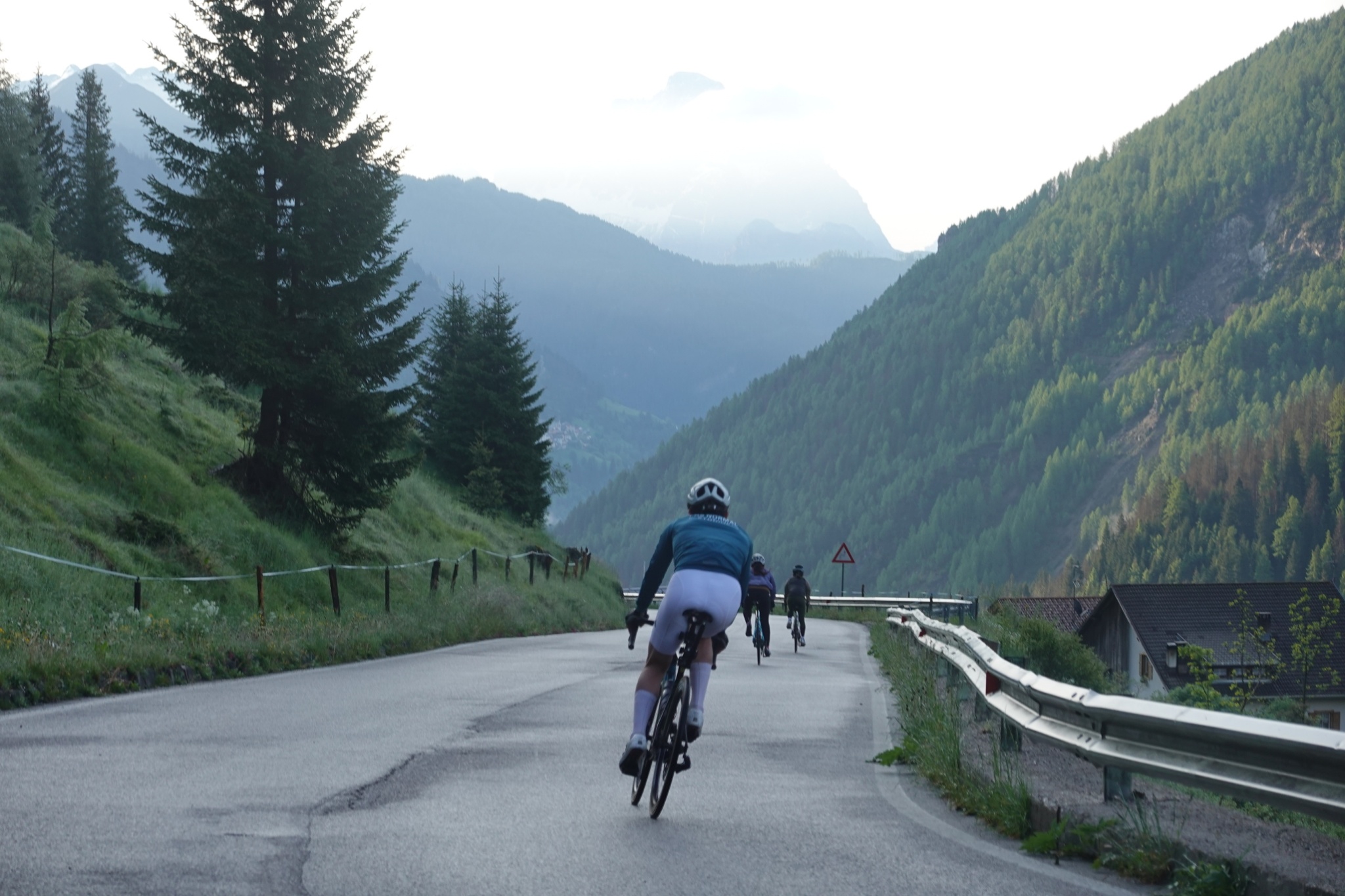 Cyclists riding together on a mountain road