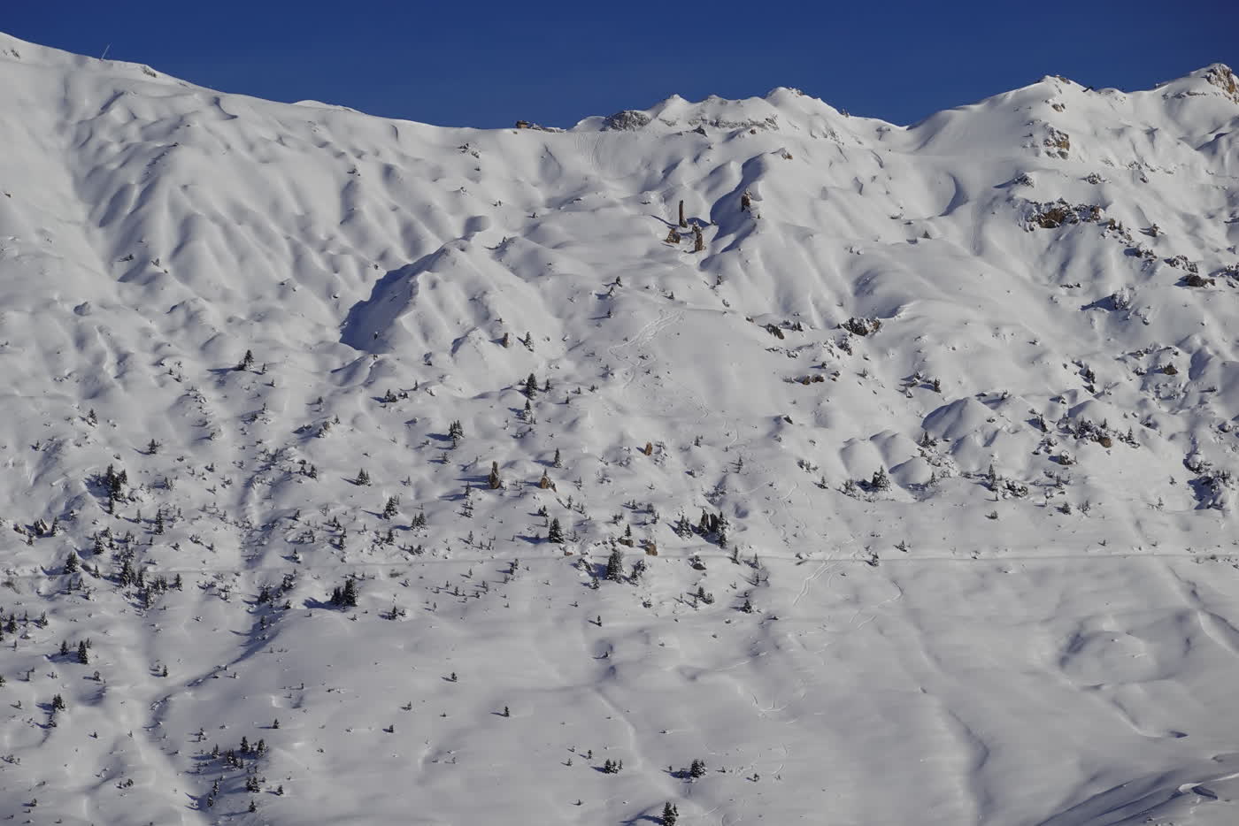Steep snowy terrain in La Plagne