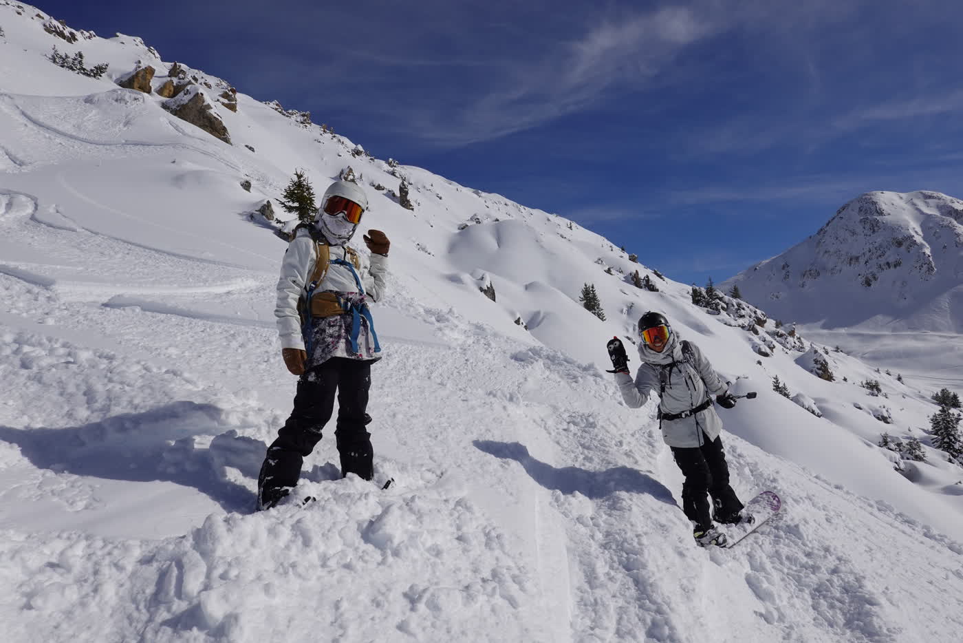 Two skiers descending open terrain at La Plagne