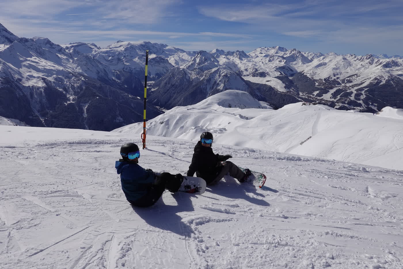 Skiers resting above the La Plagne valley