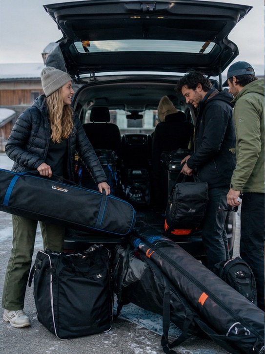 Friends loading ski bags before moving to the next resort