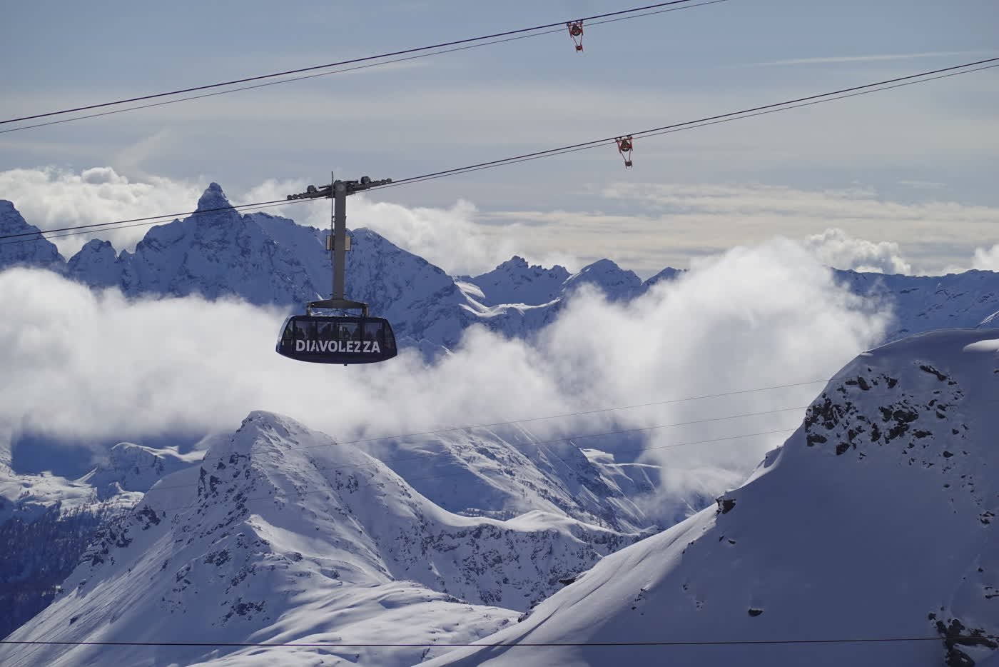 Cable cars crossing high mountains near St. Moritz