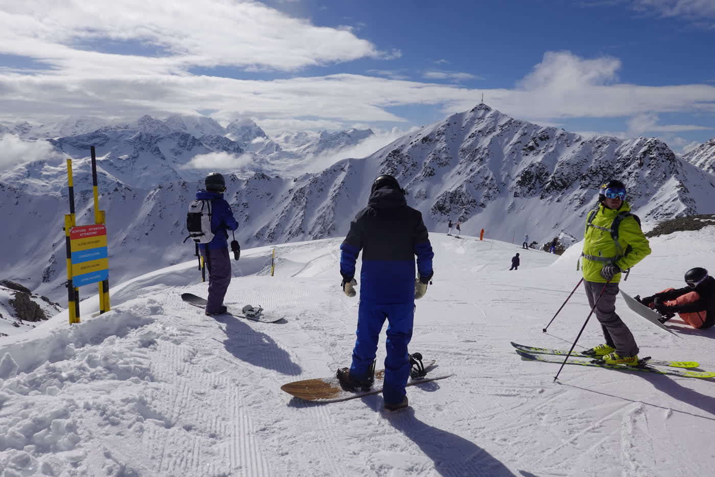 Skiers on a broad St. Moritz piste