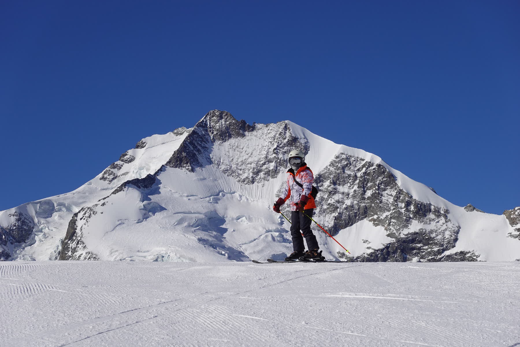Skier beneath the Engadin mountains near St. Moritz